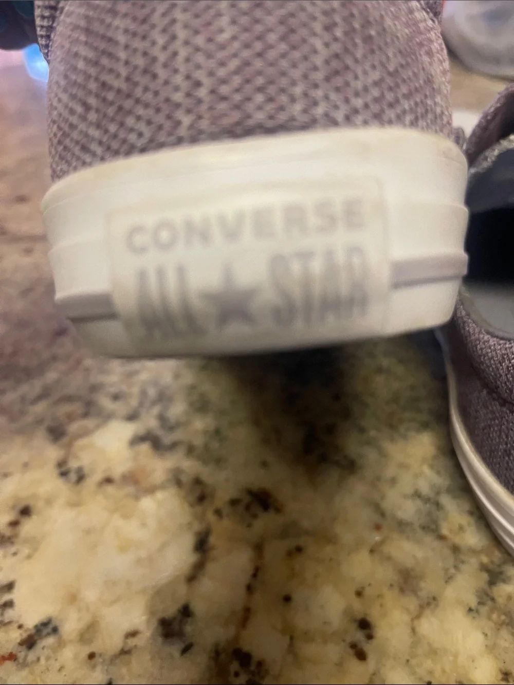 Converse Low-Top Canvas Sneakers in Dusty Plum with White Trim.